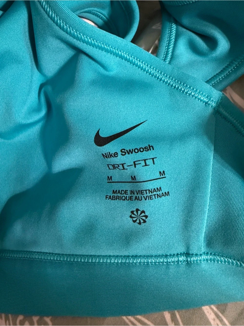 Nike Women’s Teal Sports Bra with White Swoosh